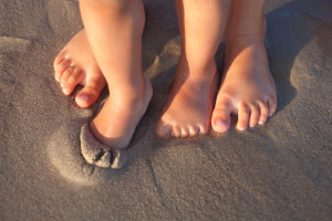 Models for Out-Toeing or Duck-Footedness in Children standing in sand