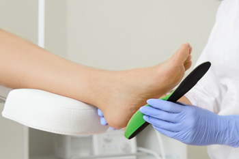 Patient being fitted for Heel Cups