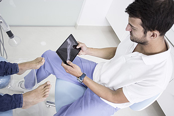 Foot and Ankle Surgeon speaking to a patient