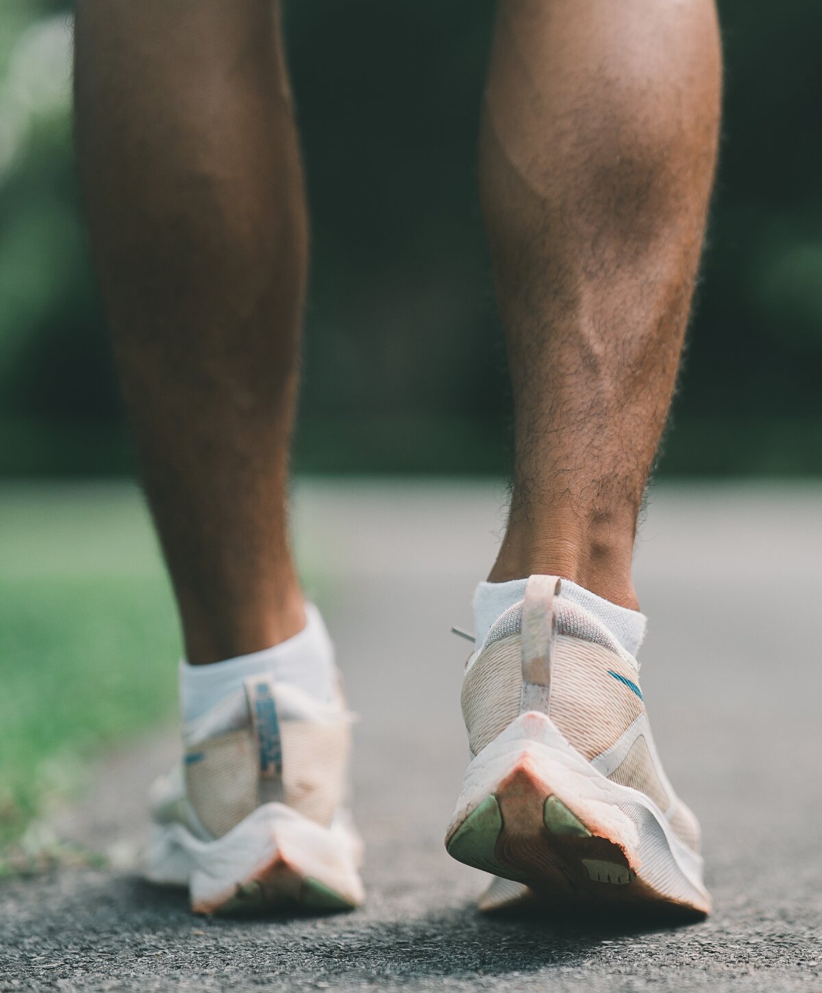 Ann Arbor heel pain treatment model with white shoes